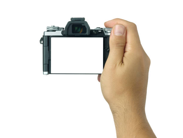 istock Hand holding and taking shot with blank display mirrorless camera isolated 880873106