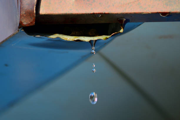 istock Water droplets falling from the roof drain 880890924