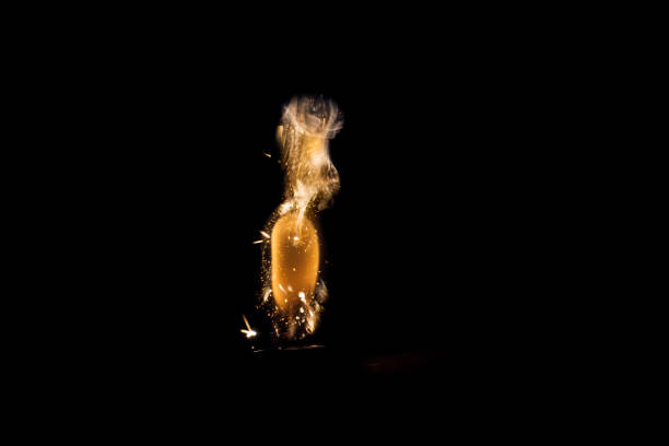 istock Close up view of real sparking light from lighter in dark black background 880891250