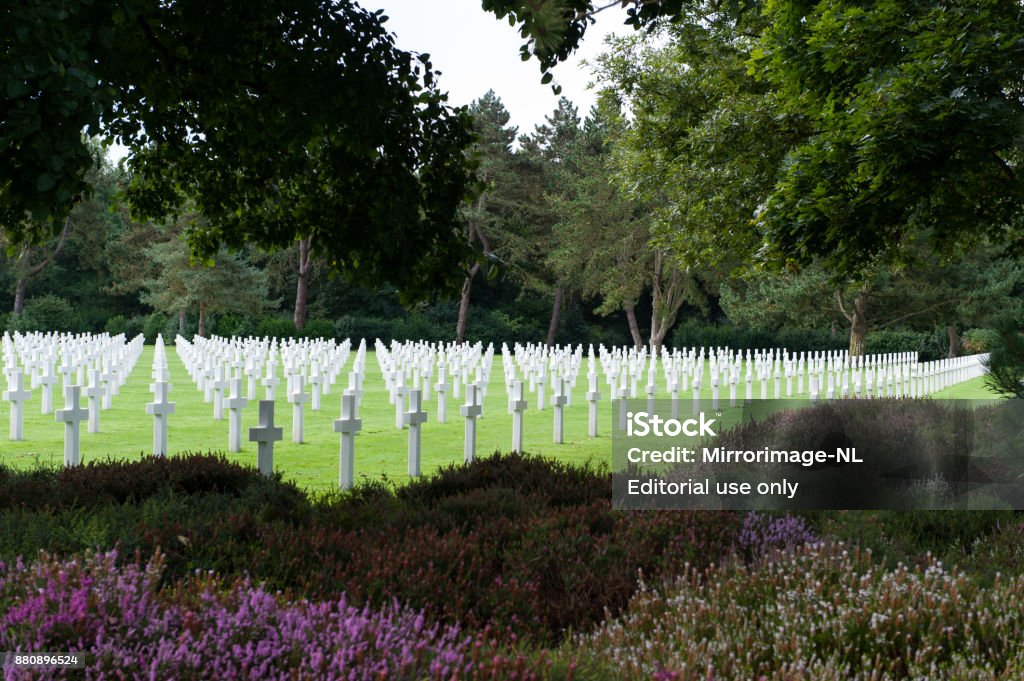 Rows of white crosses at the American Cemetery at Omaha Beach Image of part of the Normandy American cemetery. The cemetery is located at Colleville-sur-Mer in Normandy near Omaha Beach, one of the landing beaches of D-Day in June 1944, and contains the graves of 9.385 military dead, most of whom lost their lives in the D-Day landings and following operations. American Culture Stock Photo