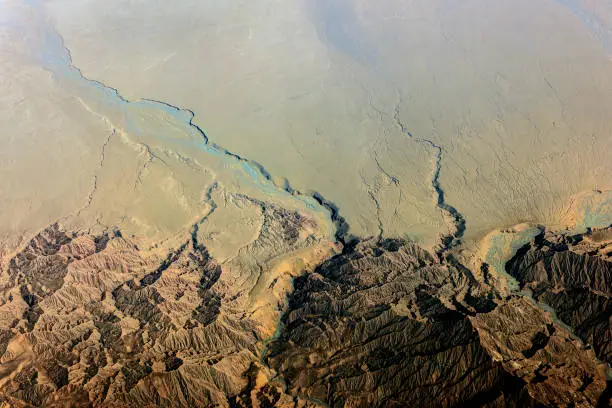 Aerial view of Tibet and Taklamakan Desert in China, valleys and rivers. Nikon D3x.