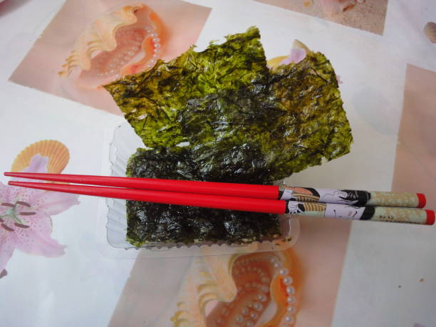 Plates of dried sea kale and Chinese sticks / Dried algae / Plates of dried sea kale and Chinese sticks / Dried algae / Snack plastination photos stock pictures, royalty-free photos & images