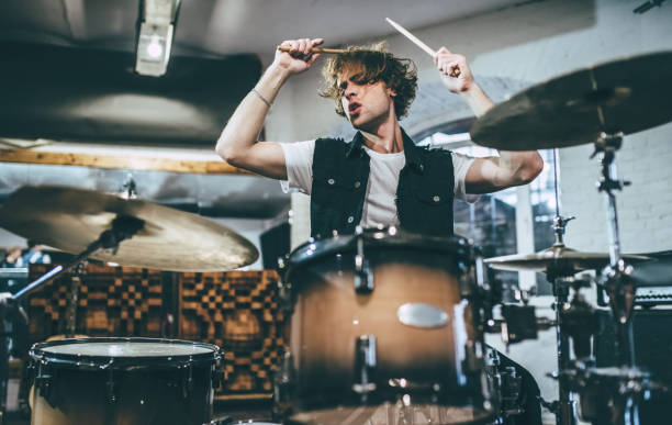 Music band repetition. Repetition of rock music band. Drummer behind the drum set. Rehearsal base drummer stock pictures, royalty-free photos & images