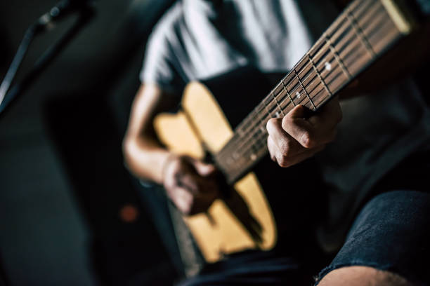 istock Lyric singer with acoustic guitar. 880905448