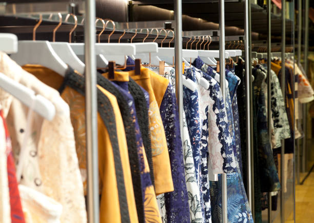 istock Designer clothes hanger in a row 880905456