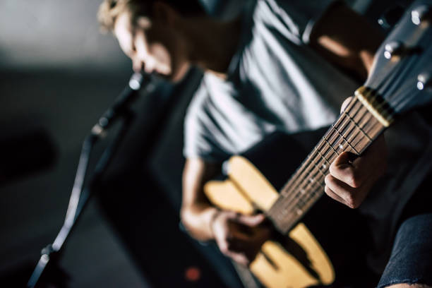 istock Lyric singer with acoustic guitar. 880905482
