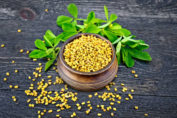 istock Fenugreek with leaf in bowl on black board 880909000