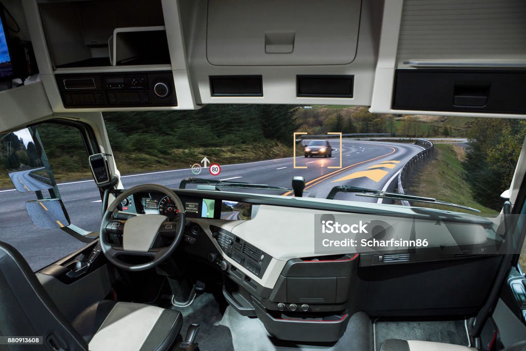 Self driving truck with head up display on a road. Self driving truck with head up display on a road. Inside view. Truck Stock Photo