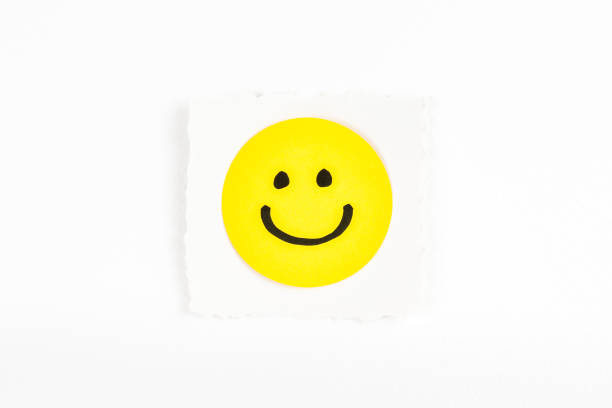 istock Happy emoticon note message on white background paper desk 880915342