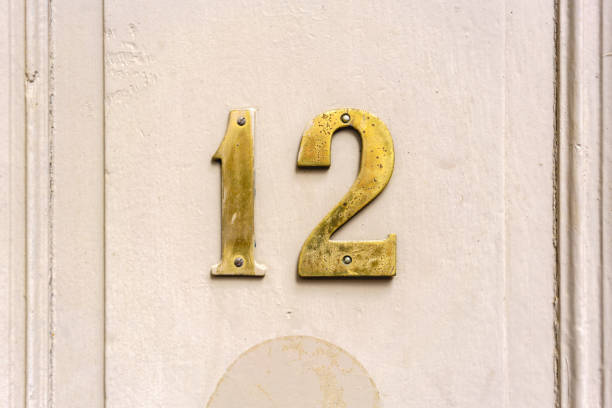 Number 12 Gold colored house number twelve (12) hook of holland stock pictures, royalty-free photos & images