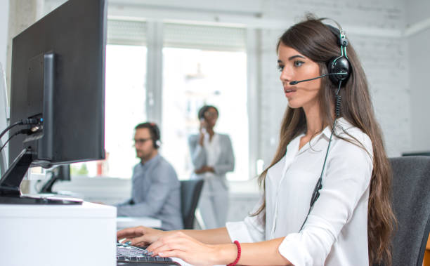 istock Portrait of female customer support operator working in call center. Help and technical support concept. 880918546