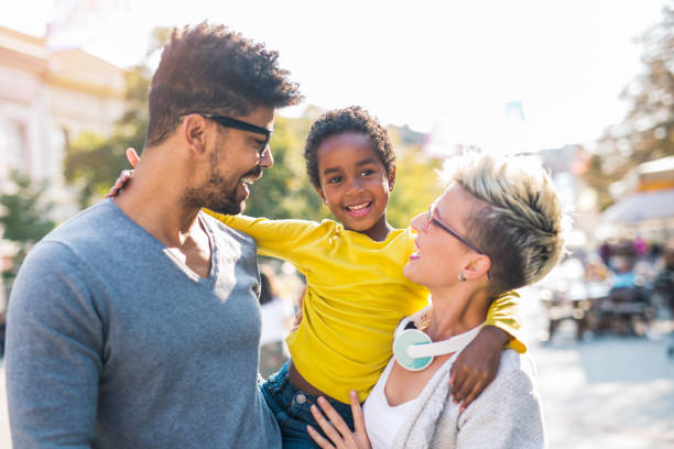 istock Happy young mixed race couple spending time with their daughter 880924360