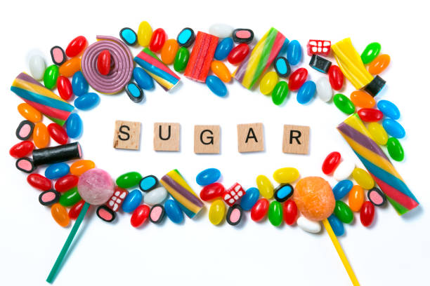 istock Diabetes concept - selection of candy on white background 880924606