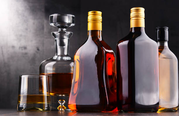 istock Carafe and bottles of assorted alcoholic beverages. 880925784