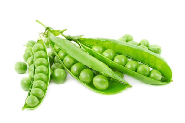 istock fresh green peas isolated on white 880928812