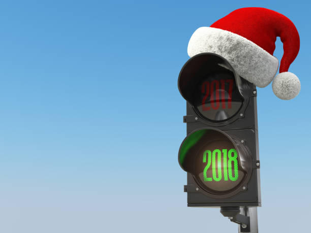 istock Happy new year 2018. Santa hat on the traffic light with green light 2018. 880933962