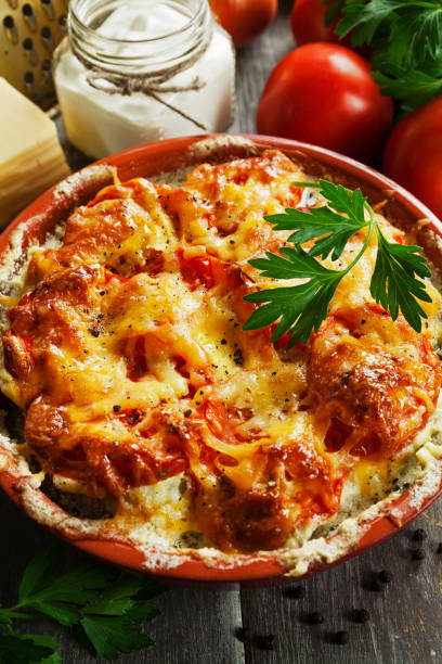 istock Fish baked with tomatoes, sour cream and cheese 880933994