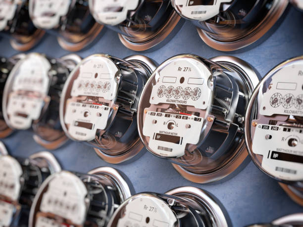 Electric meters in a row measuring power use. Electricity consumption concept. Electric meters in a row measuring power use. Electricity consumption concept. 3d illustration energy management stock pictures, royalty-free photos & images