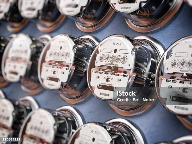 Electric Meters In A Row Measuring Power Use Electricity Consumption Concept Stock Photo - Download Image Now