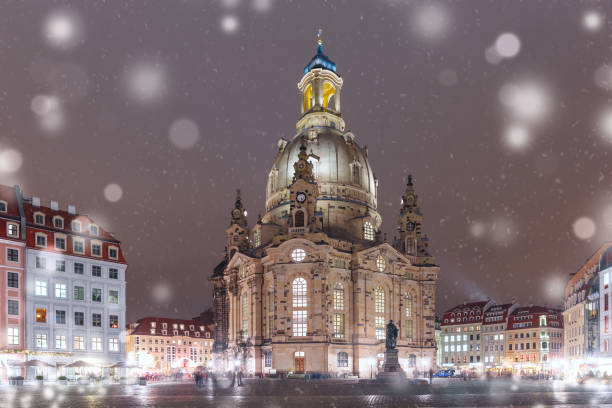 Lutheran church of Our Lady aka Frauenkirche with market place at snowy christmas night in Dresden, Saxony, Germany
