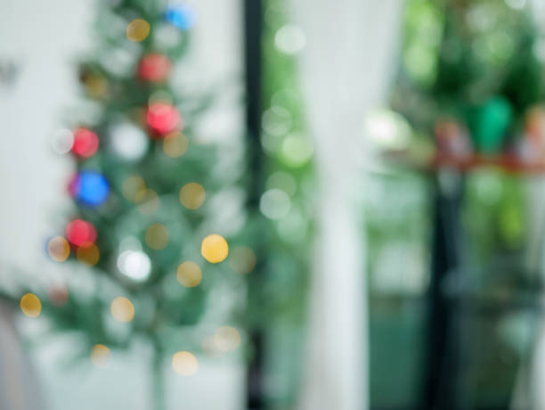 istock Bokeh blur leaf background, Decoration new year 2018, Abstract blur christmas tree falling background bokeh. 880953284