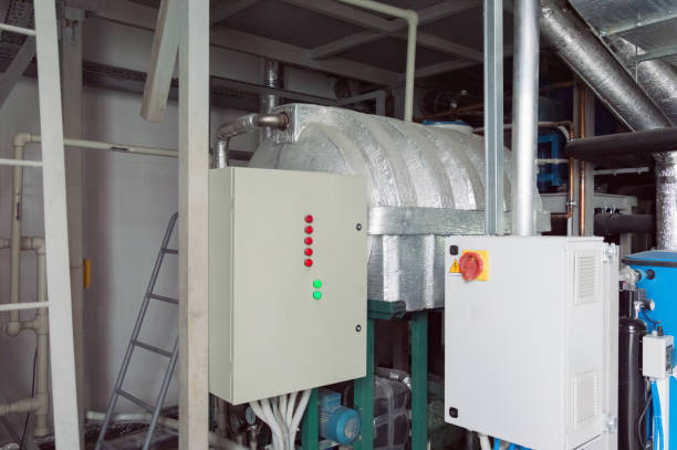 istock Two closed ventilation system control cubicles in the industrial ventilation room 880953864