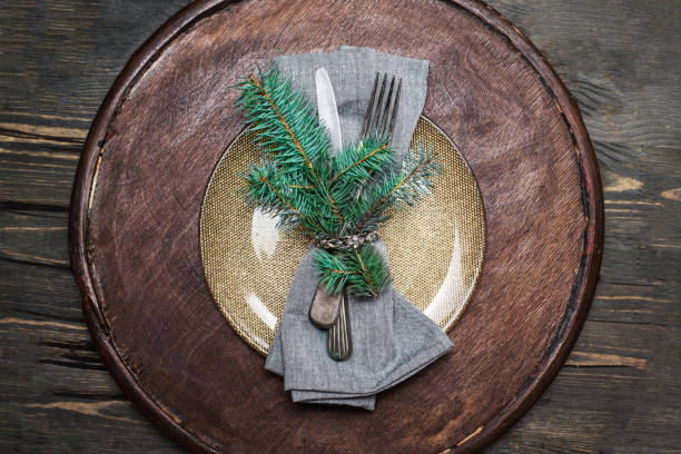 istock Christmas  Dining table setting with vintage crockery and cutlery, closeup.
