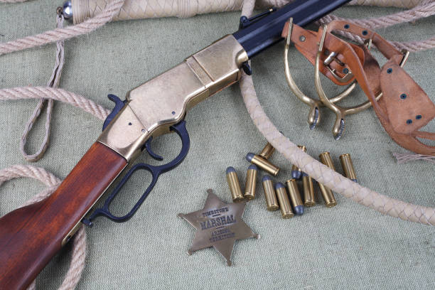 istock Wild west rifle, ammunition and sheriff badge 880966370
