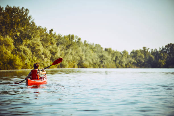 istock A canoe trip along the river along the forest in summer. 880966712