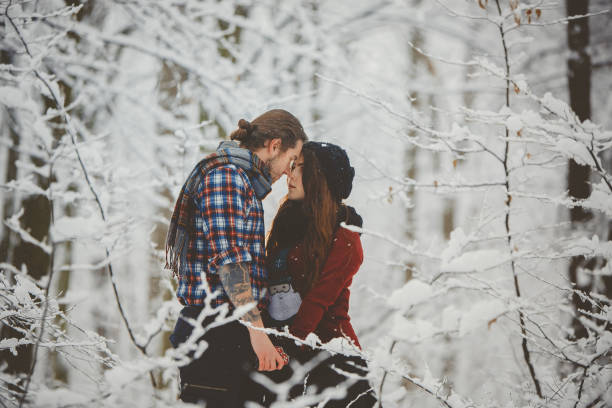 istock Couple hugging each other in winter forest 880966734