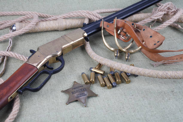 istock Wild west rifle, ammunition and sheriff badge 880969764