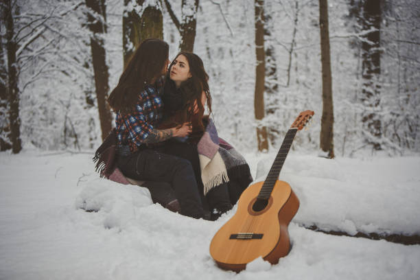 Man plays guitar to his girlfriend