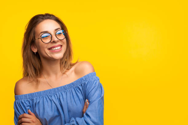 Cheerful stylish model on orange