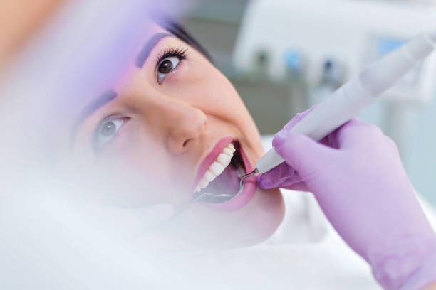 istock Woman having teeth examined at dentist office 880985078
