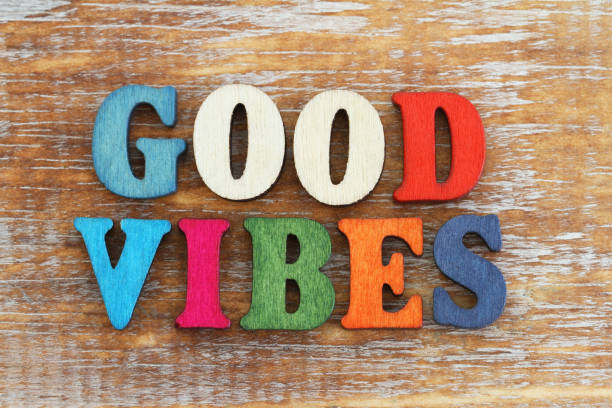 istock Good vibes written with colorful letters on rustic wooden surface 880993332