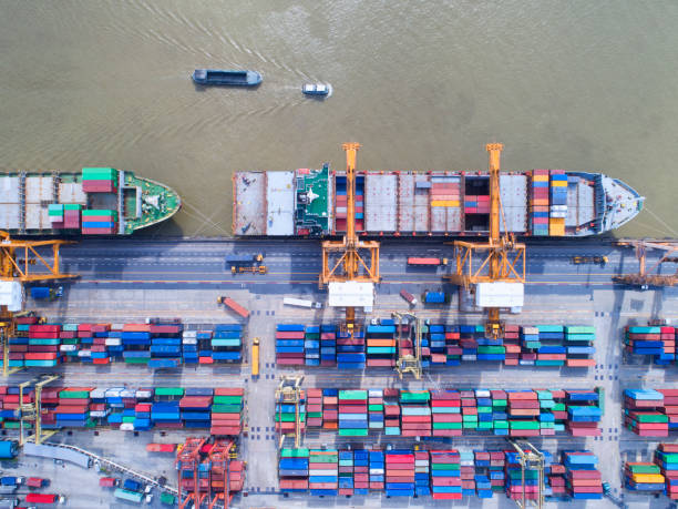 istock container,container ship in import export and business logistic,By crane,Trade Port , Shipping,cargo to harbor.Aerial view,Water transport,International,Shell Marine,transportation,logistic,trade,port 880994504