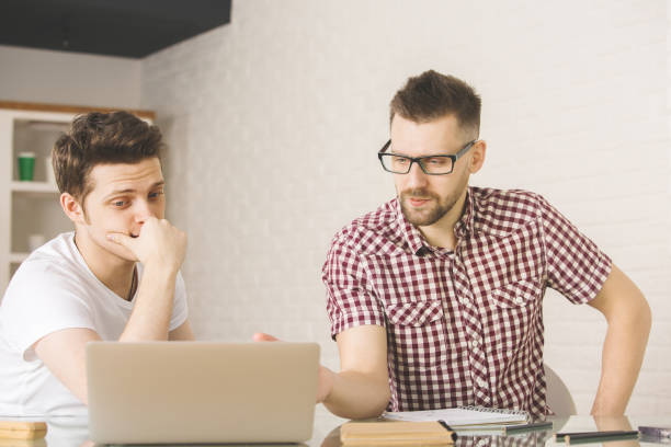 istock European businessmen working on project 880999786