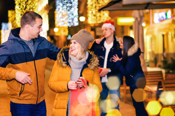 istock Friends having fun outdoors in winter city. 881003230