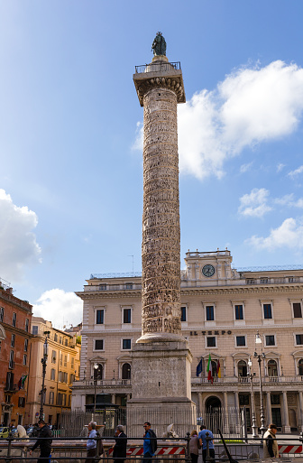 Rome, Italy - November 07, 2016: View of Piazza Colonna, which takes its name from the Column of Marco Aurelio, celebrating his victory over the Germans.