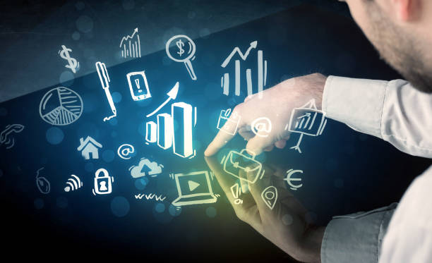 istock Man touching technology smart table with business icons 881009456