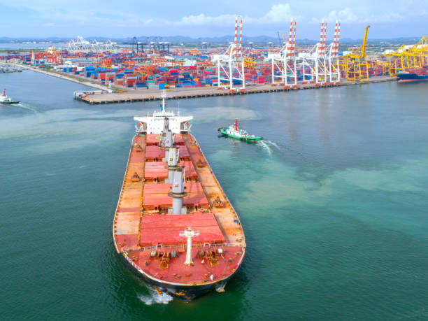 istock container,container ship in import export and business logistic,By crane,Trade Port , Shipping,cargo to harbor.Aerial view,Water transport,International,Shell Marine,transportation,logistic,trade,port 881013652
