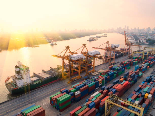 istock container,container ship in import export and business logistic,By crane,Trade Port , Shipping,cargo to harbor.Aerial view,Water transport,International,Shell Marine,transportation,logistic,trade,port 881015812