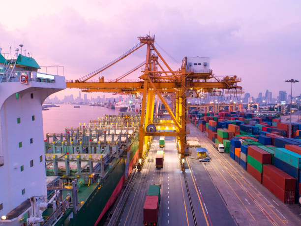 istock container,container ship in import export and business logistic,By crane,Trade Port , Shipping,cargo to harbor.Aerial view,Water transport,International,Shell Marine,transportation,logistic,trade,port 881015830