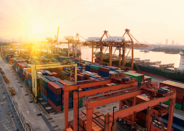 istock container,container ship in import export and business logistic,By crane,Trade Port , Shipping,cargo to harbor.Aerial view,Water transport,International,Shell Marine,transportation,logistic,trade,port 881015852
