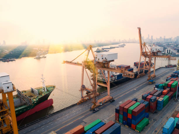 istock container,container ship in import export and business logistic,By crane,Trade Port , Shipping,cargo to harbor.Aerial view,Water transport,International,Shell Marine,transportation,logistic,trade,port 881015860