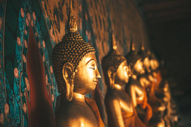 istock Row of Buddhas in a temple 881031178