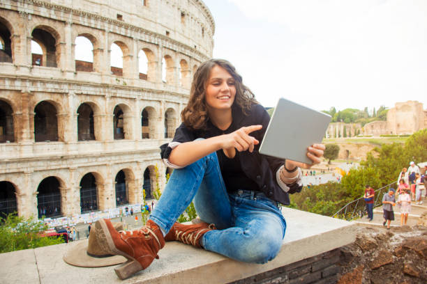 istock Smiling woman in front of Colosseum 881031254