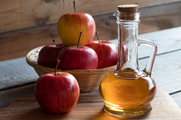 istock A bottle of apple cider vinegar with apples 881038300