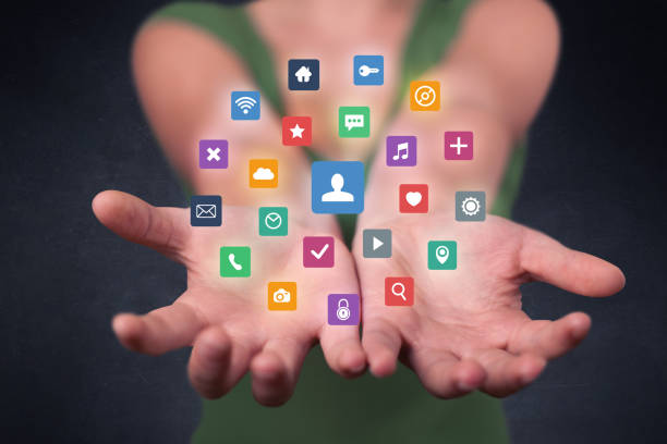 istock Woman holding colorful applications 881051672
