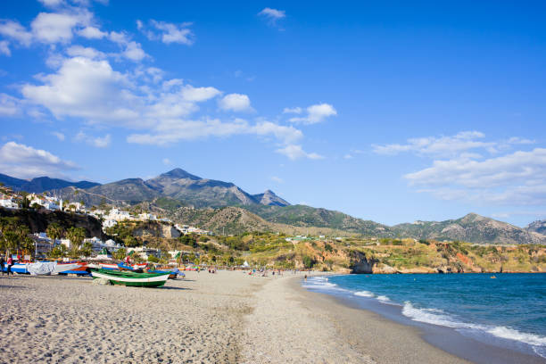Burriana Beach in Nerja Burriana Beach at the Mediterranean Sea in Nerja, Spain, Costa del Sol, southern Andalusia region. nerja stock pictures, royalty-free photos & images